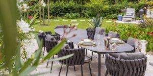 dining-table-in-the-garden-royalty-free-image-1053434064-1552338276